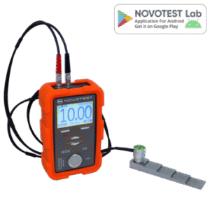 Ultrasonic Thickness Gauge NOVOTEST UT-1M - Alat ukur ketebalan ultrasonik portabel dengan layar digital dan probe.